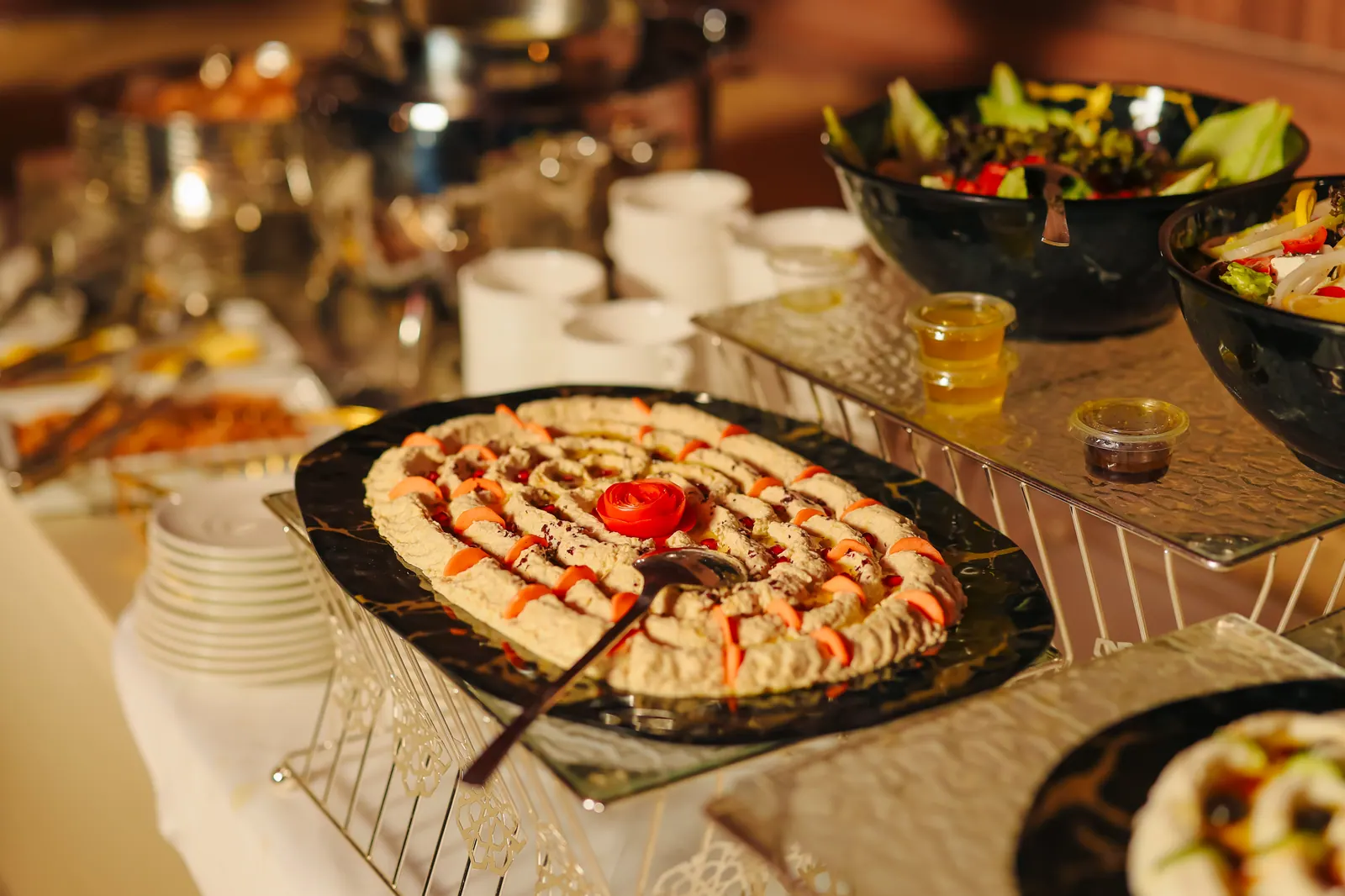 A long dining table set in the desert