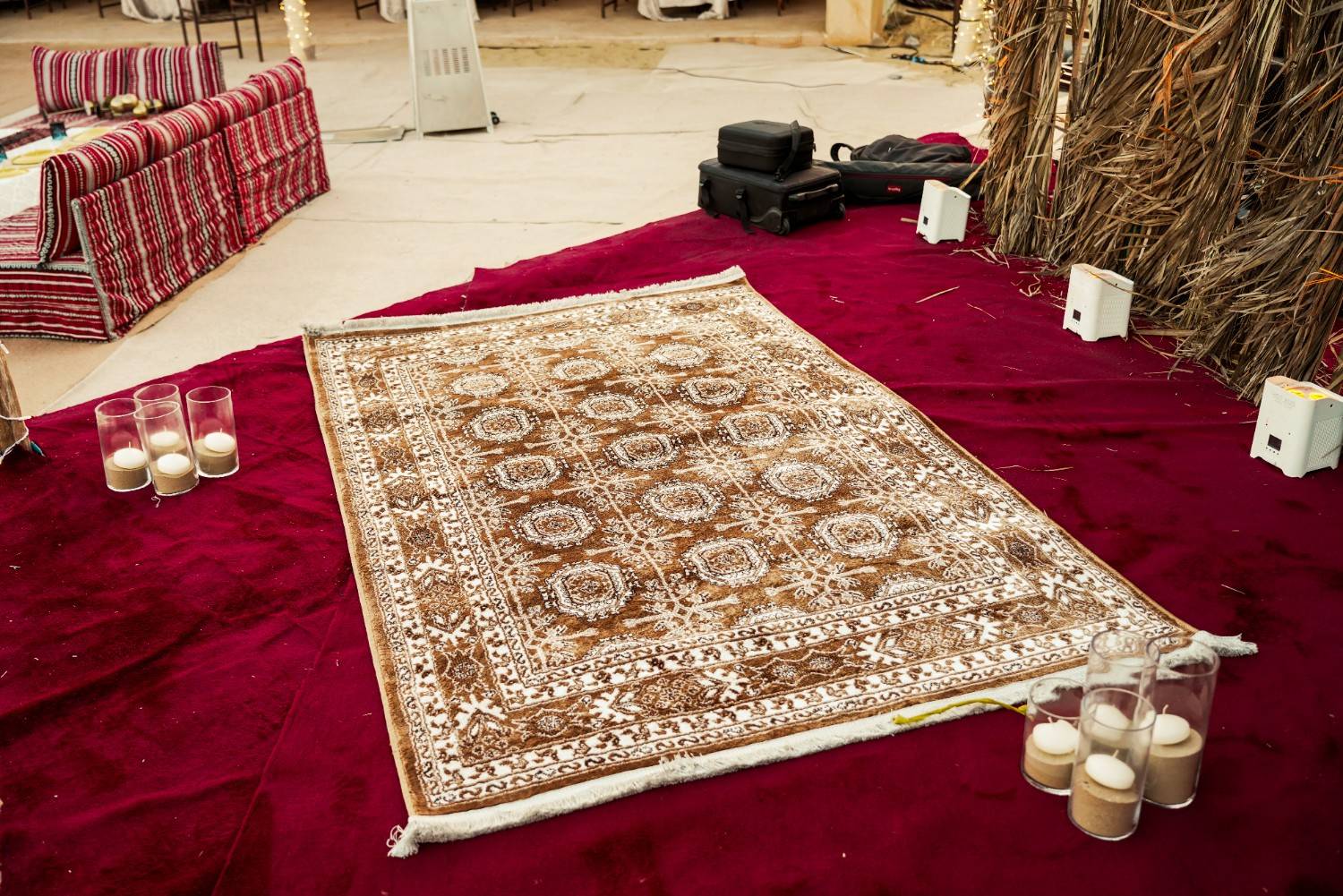 Persian rug and majlis floor seating on velvet platform