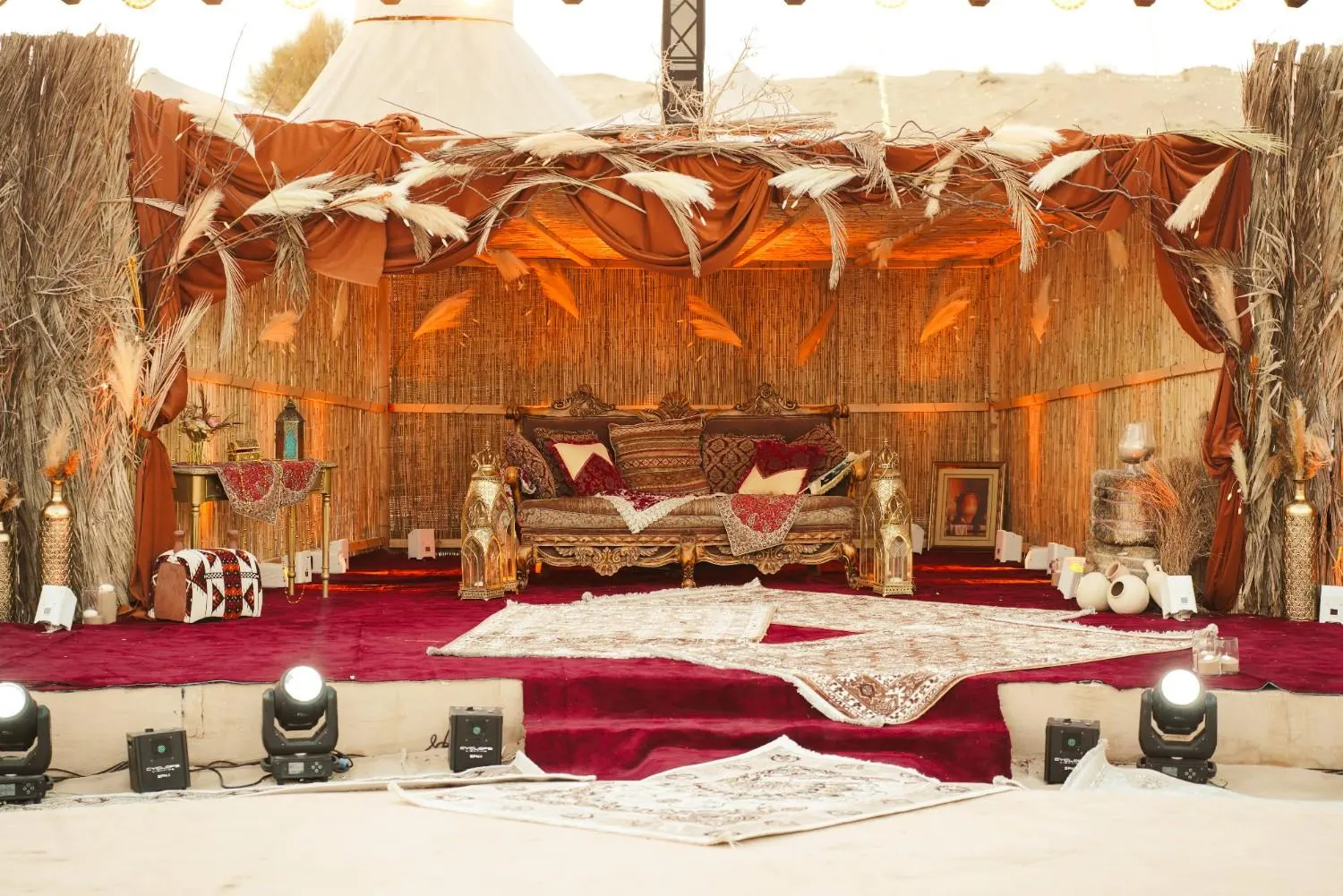 Mehendi mandap with pampas and copper drapes at our Abu Dhabi desert camp
