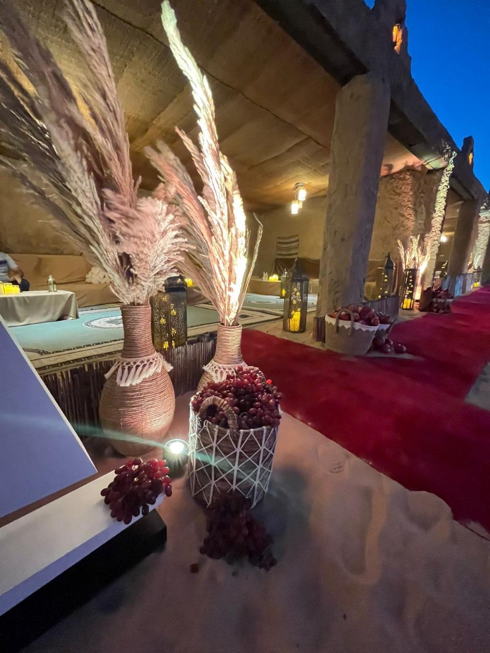 Pampas and lantern styling along a gala dinner arrival walk in Abu Dhabi