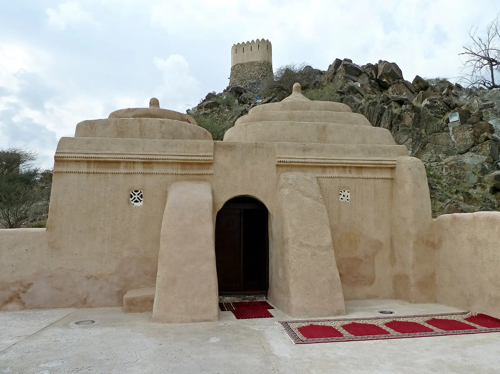 UAE National Day in Fujairah: Event Ideas for Companies and Hotels Al Bidyah Mosque below its mountain watchtower