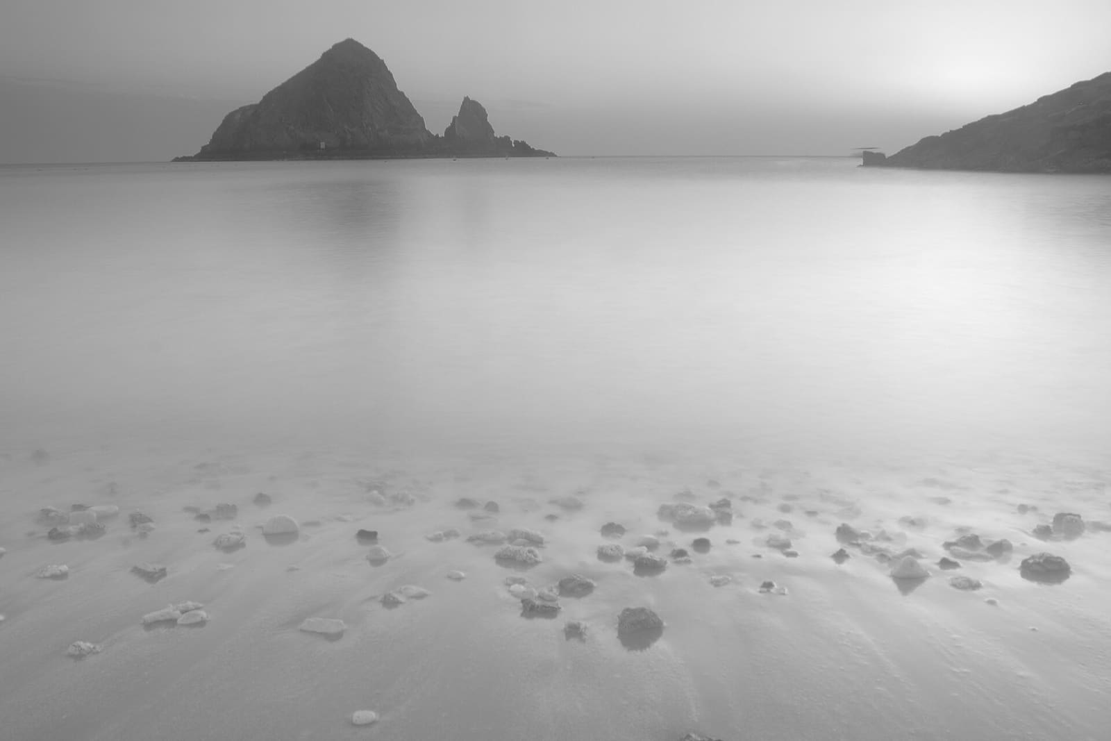 Snoopy Island rising from still water off Fujairah
