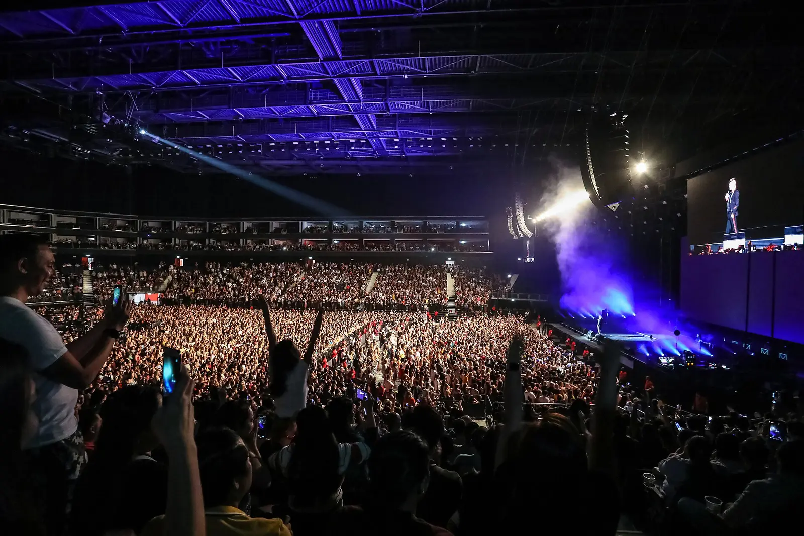 How to Avoid Fake Event Tickets in the UAE A packed concert at Coca-Cola Arena in Dubai with a lit stage